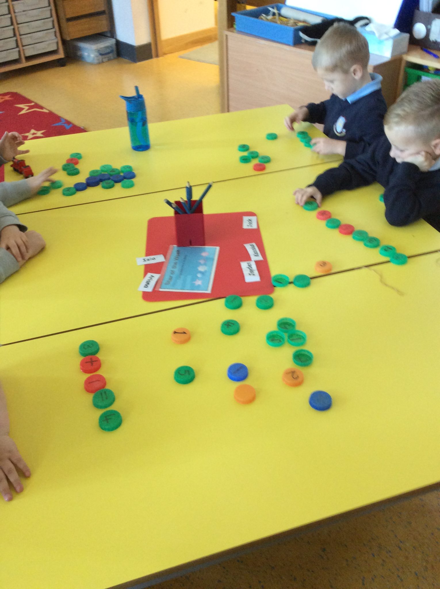 Maths fun using milk bottle tops really! Hanover Street School, Aberdeen